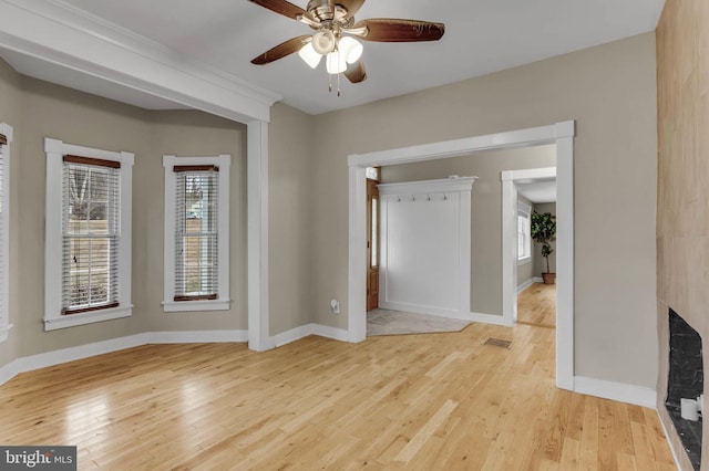 interior space with ceiling fan and light hardwood / wood-style floors