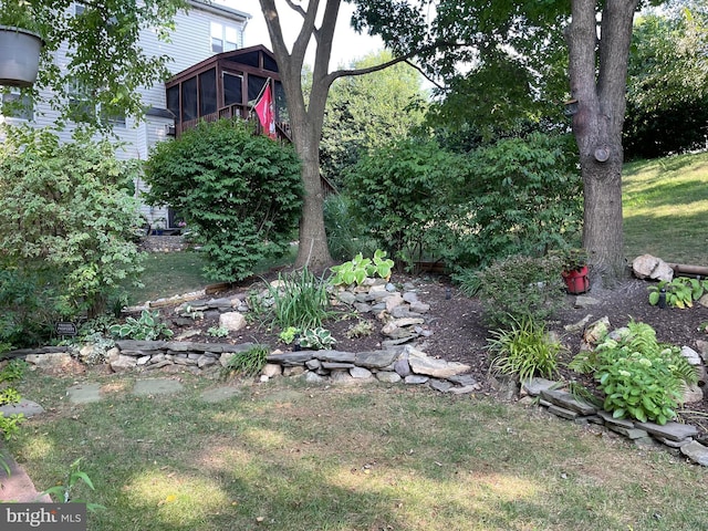 view of yard featuring a sunroom