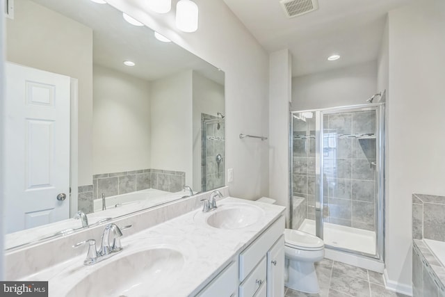 full bathroom with shower with separate bathtub, vanity, tile patterned floors, and toilet