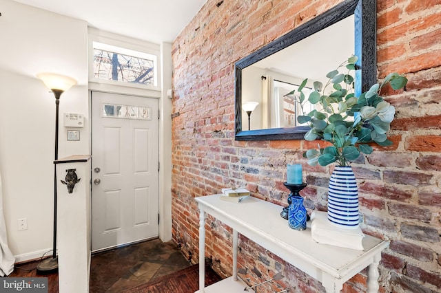 entrance foyer with brick wall