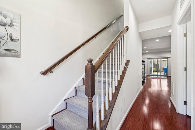 staircase featuring hardwood / wood-style flooring