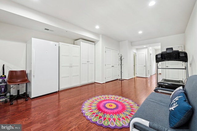 exercise area with hardwood / wood-style flooring