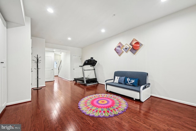 living area with hardwood / wood-style floors