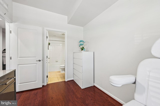 full bathroom featuring tiled shower / bath, wood-type flooring, vanity, and toilet