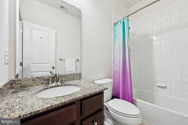 full bathroom featuring vanity, toilet, and shower / tub combo with curtain