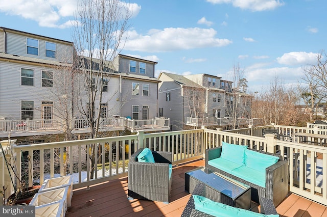 wooden deck featuring outdoor lounge area