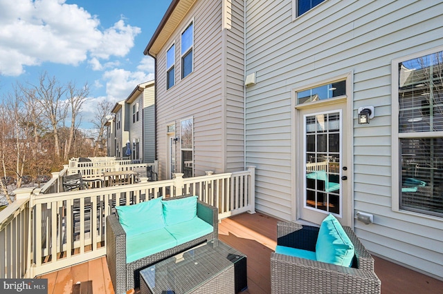 wooden deck featuring an outdoor living space