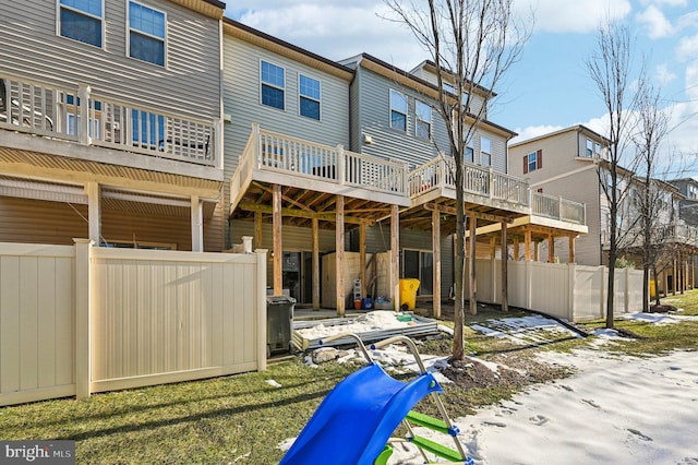 back of house featuring a playground