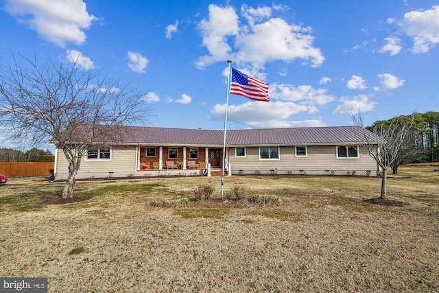 ranch-style home featuring a front lawn