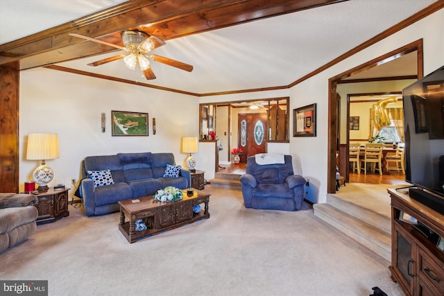 living room with ornamental molding, light colored carpet, and ceiling fan