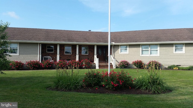 ranch-style home with a front lawn