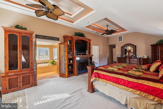 carpeted bedroom featuring ceiling fan and lofted ceiling