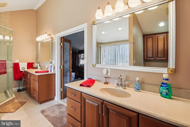 bathroom featuring lofted ceiling, vanity, an enclosed shower, and tile patterned flooring