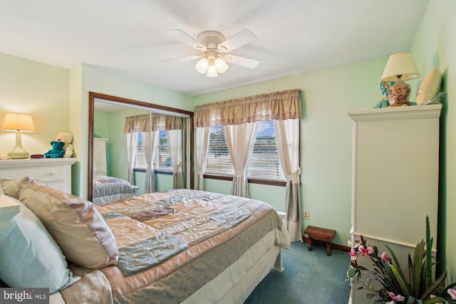 bedroom featuring multiple windows, ceiling fan, and carpet