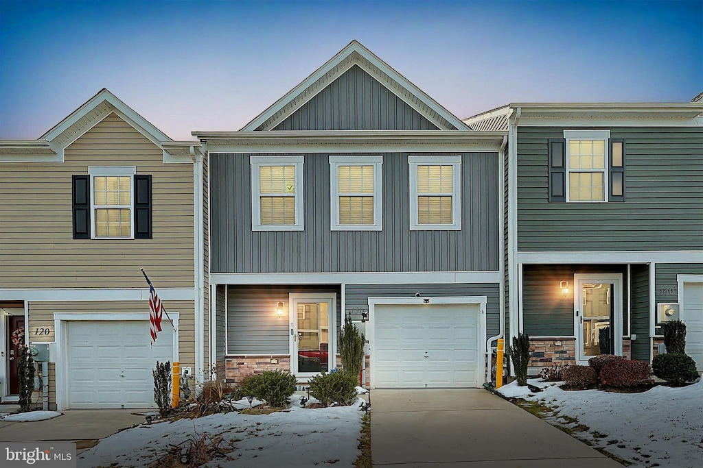 multi unit property featuring a garage