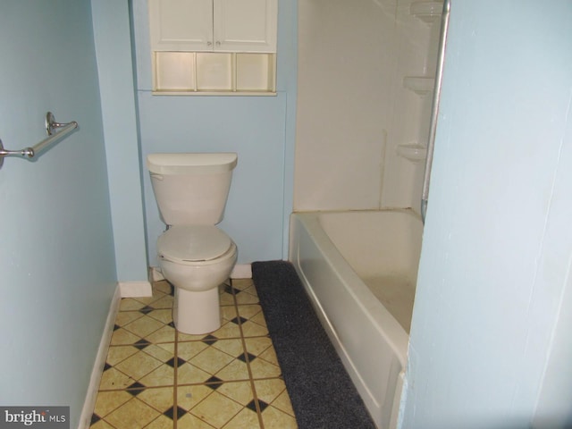 bathroom with tile patterned floors and toilet