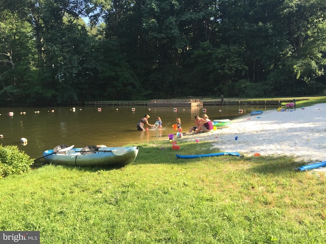 view of community with a water view