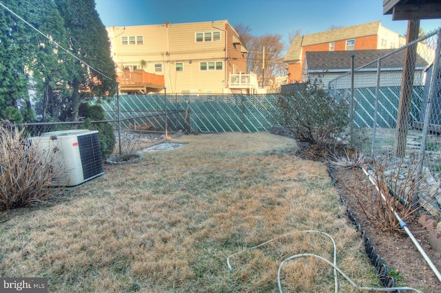 view of yard with central air condition unit