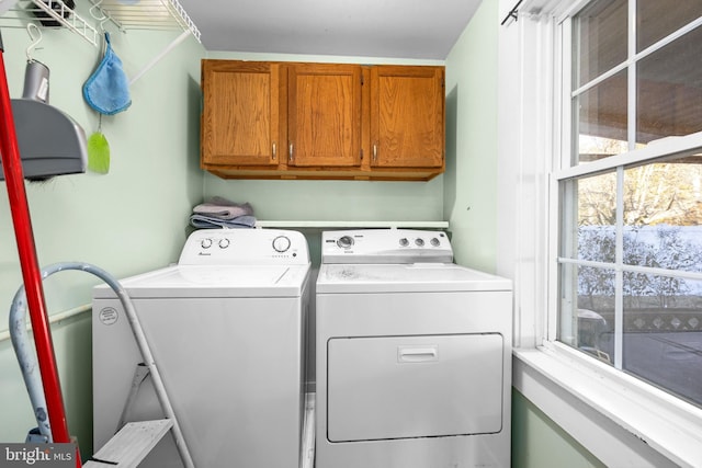 laundry area featuring cabinets and washer and dryer