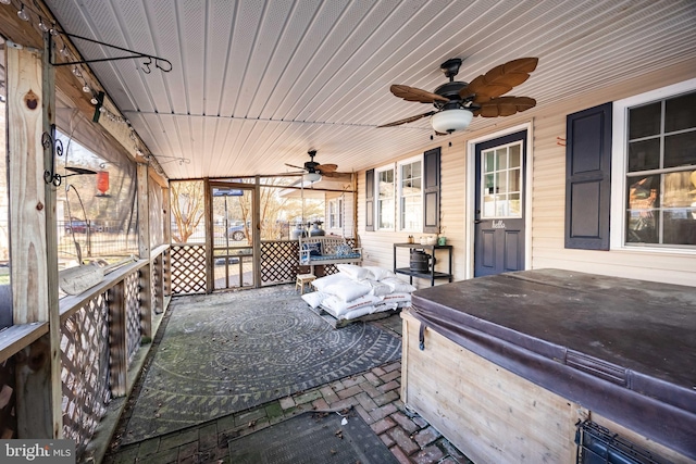 view of patio with a hot tub and ceiling fan