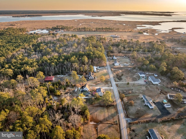 aerial view at dusk with a water view