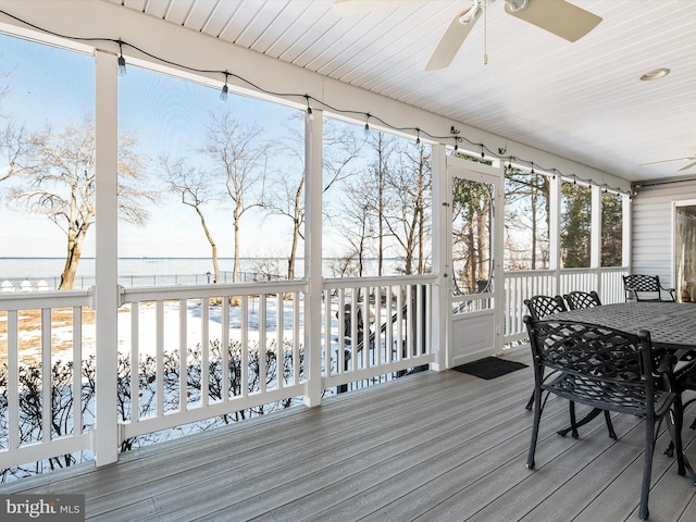 sunroom featuring wood ceiling and ceiling fan