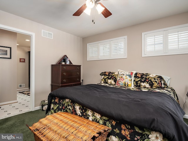 carpeted bedroom featuring ceiling fan