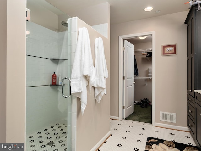 bathroom with vanity and an enclosed shower