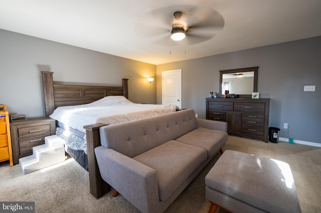 bedroom with light colored carpet and ceiling fan