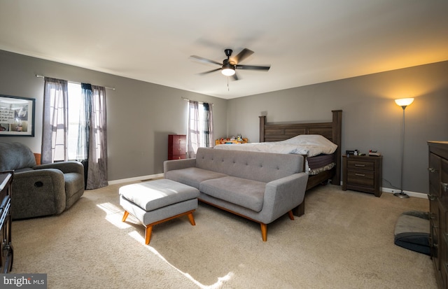 carpeted bedroom with multiple windows and ceiling fan