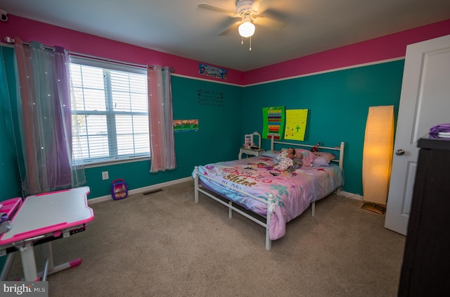 carpeted bedroom with ceiling fan