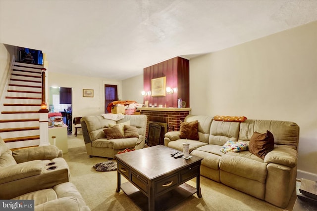 living room with carpet floors and a brick fireplace