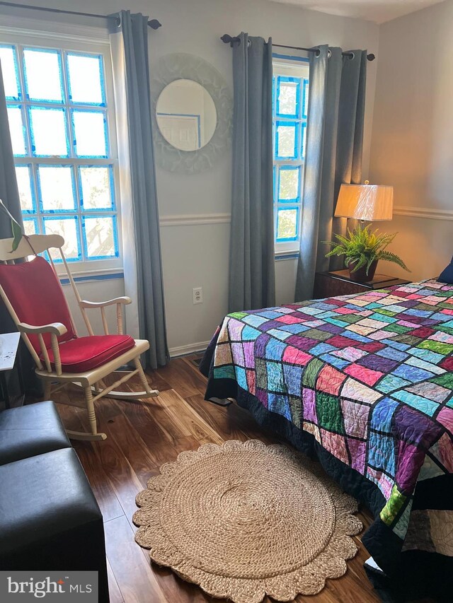 bedroom with wood finished floors