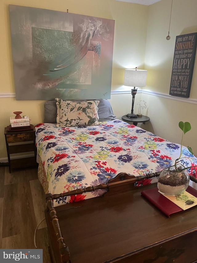 bedroom featuring wood finished floors
