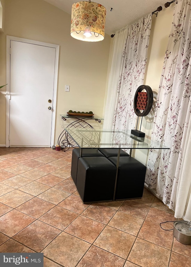 dining area with tile patterned flooring