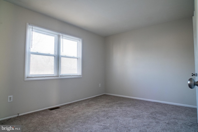 unfurnished room with carpet floors