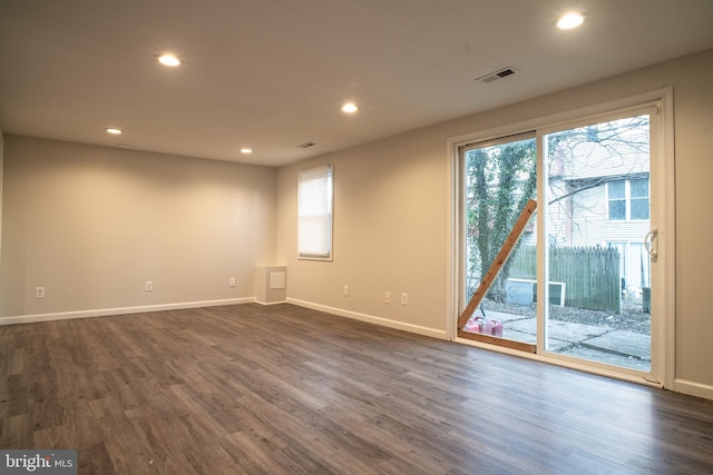 spare room with dark hardwood / wood-style floors