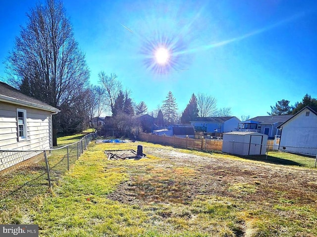 view of yard with a storage unit