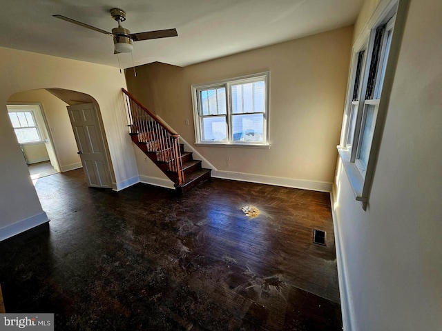 unfurnished room featuring dark hardwood / wood-style flooring and ceiling fan