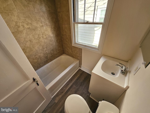 bathroom with vanity, toilet, and hardwood / wood-style floors