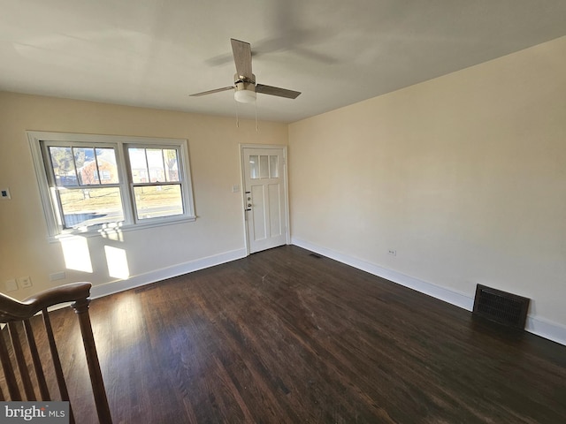 interior space with dark hardwood / wood-style floors and ceiling fan