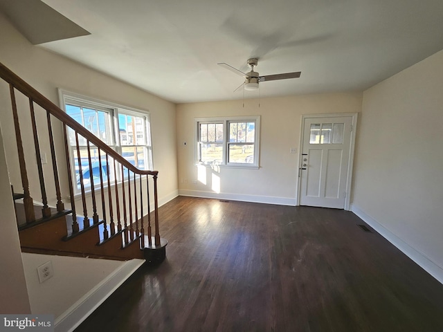 foyer entrance with dark hardwood / wood-style flooring and ceiling fan