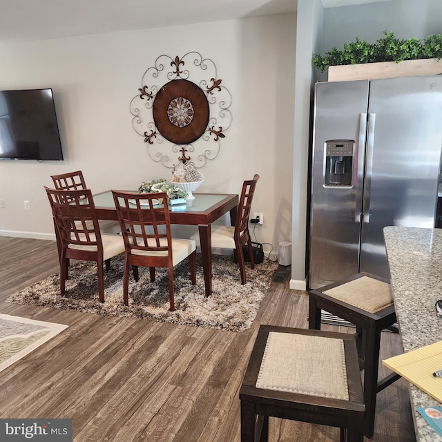 dining area with dark wood-type flooring