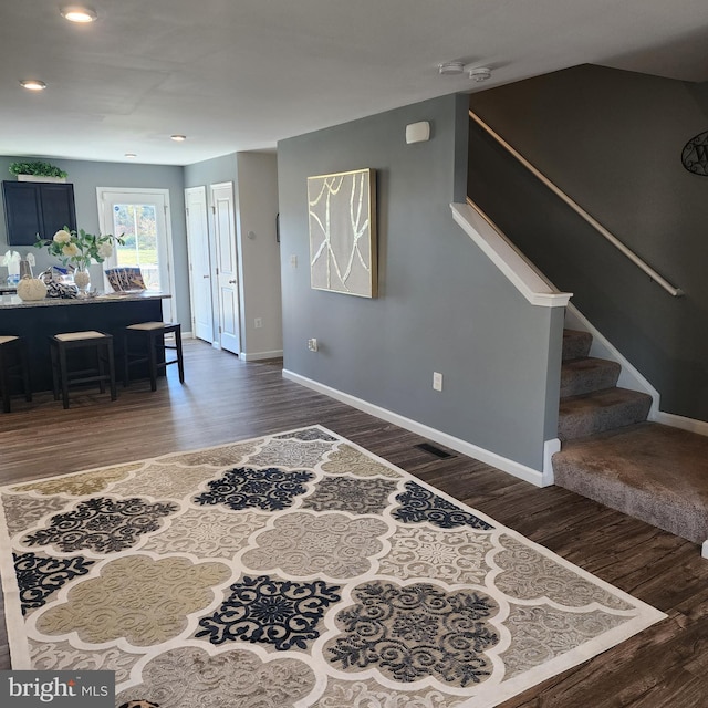 interior space with dark hardwood / wood-style floors