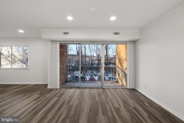 unfurnished room featuring crown molding and dark hardwood / wood-style flooring