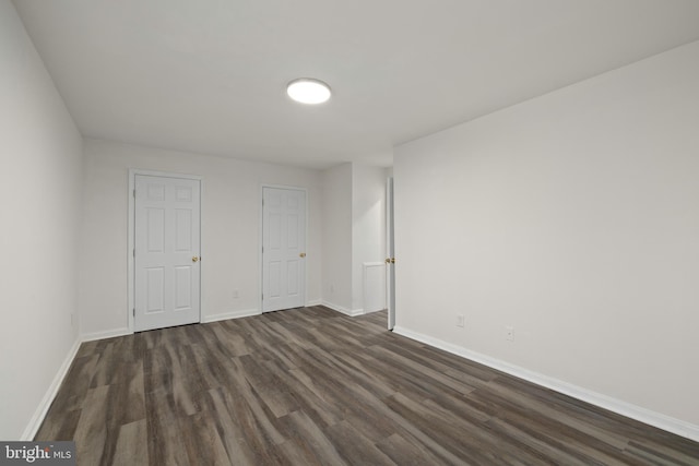 empty room featuring dark hardwood / wood-style floors