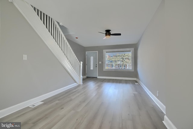 entryway with ceiling fan and light hardwood / wood-style floors