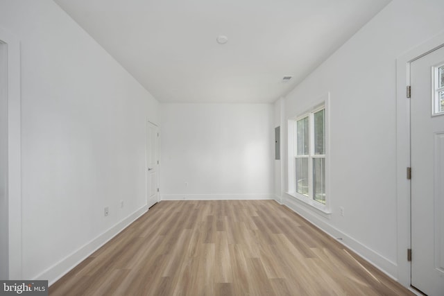 unfurnished room featuring light wood-type flooring