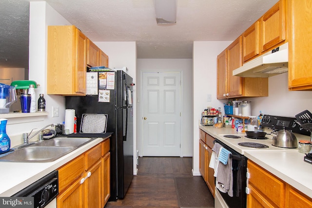 kitchen featuring sink, black fridge, white dishwasher, dark hardwood / wood-style flooring, and range with electric cooktop