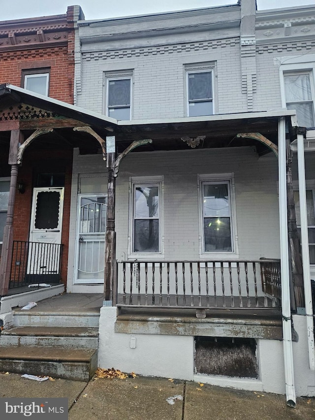 doorway to property featuring a porch